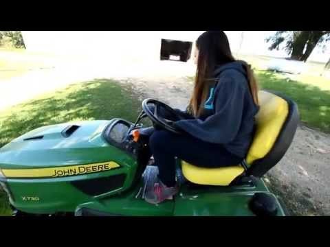 Driving her first (lawn) tractor!